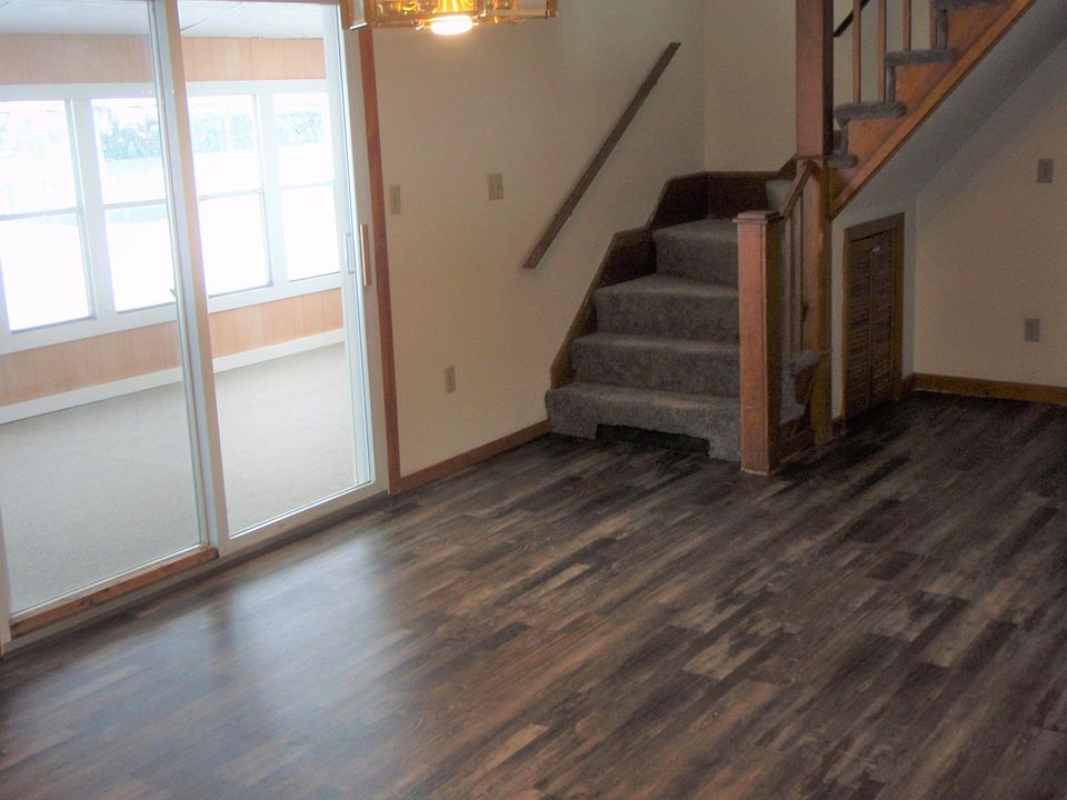 New laminate flooring in dining - slider to screen porch
