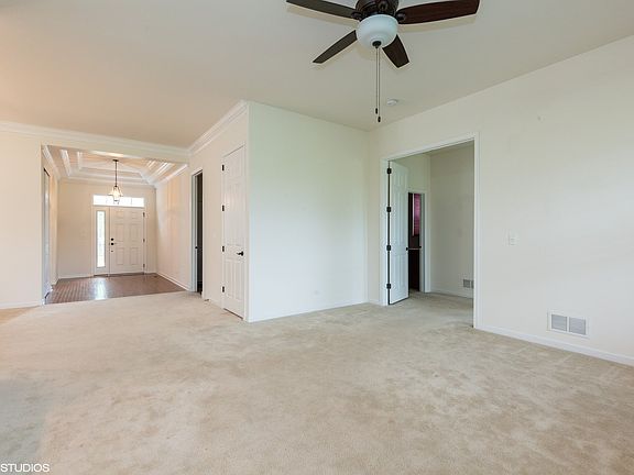 Looking toward front door and into master bedroom