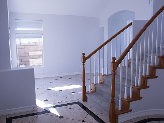 Family room and stair in the front entrance leading upstairs