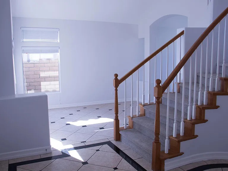 Family room and stair in the front entrance leading upstairs