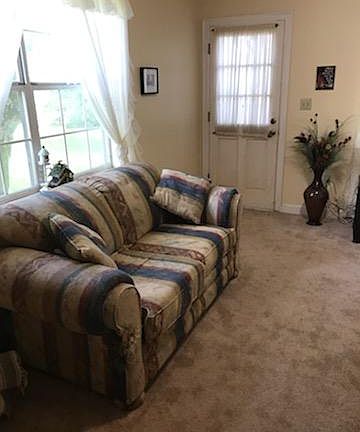 Den with door to outside.