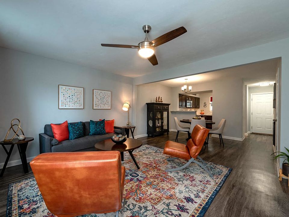 Renovated kitchen with dark cabinetry and stainless steel appliances.
