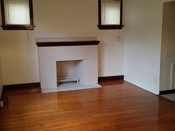 Living Room featuring hardwood floors and fire place. Fire