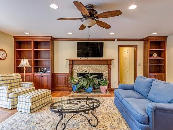 Just through the garage entrance the recently updated living room and kitchen. Sliding door has access to the pool area.