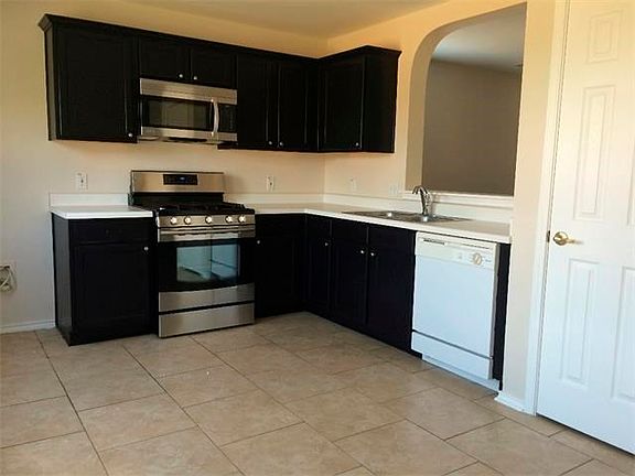 New Gas Range and Built in Microwave.  Hard tile floors, pantry.  Open to living room.