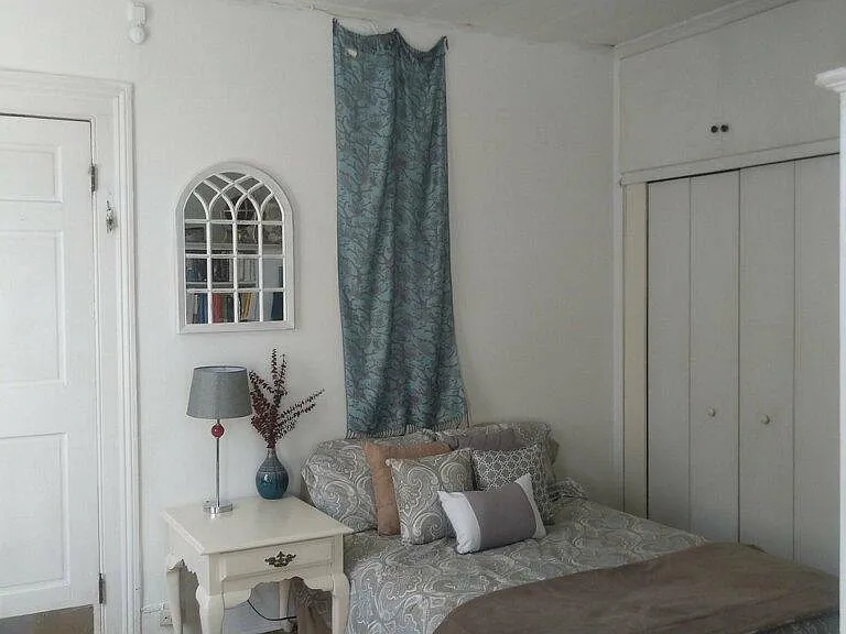 Small area for bed in front of the closet