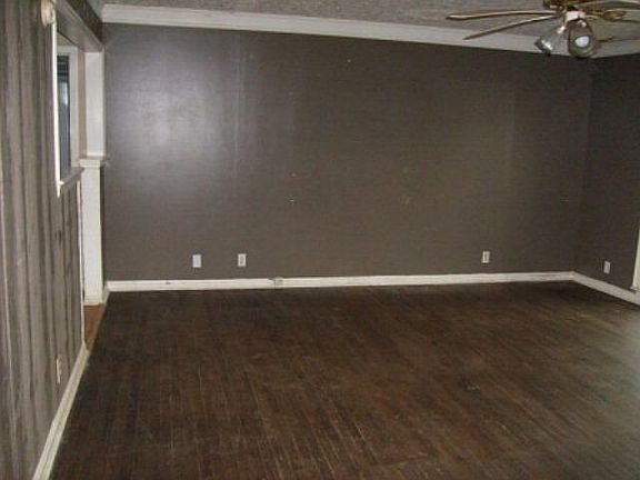 Living room color of walls before painting and cleaning floors.