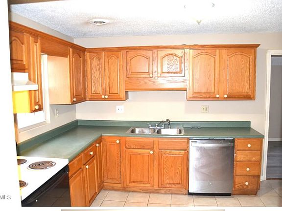 Kitchen with plenty of counter space.
Includes frig, stove, and dishwasher.