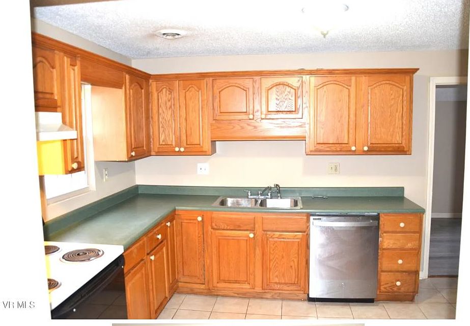 Kitchen with plenty of counter space.
Includes frig, stove, and dishwasher.
