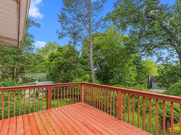 Large deck that overlooks the backyard - ideal for outdoor dining or relaxing.