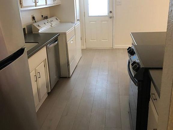 Convenient kitchen with door to back patio.