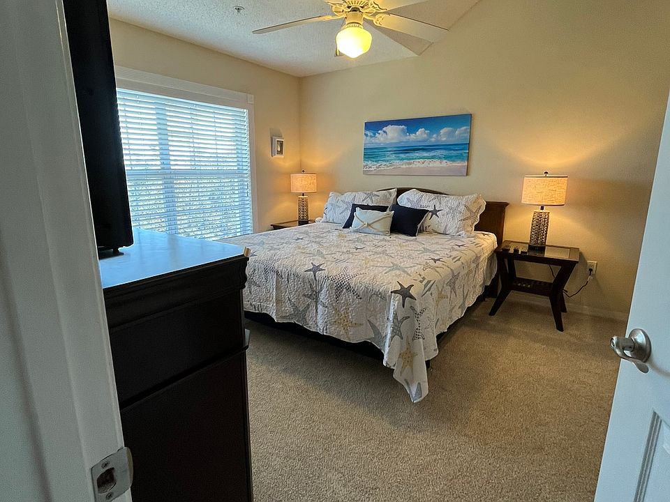 This image is of the Master bedroom with King sized bed and an attached bathroom.