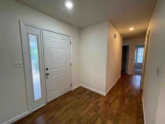 Entry hall to three bedrooms, hall closet, full bath, laundry room and Master Bedroom suite.