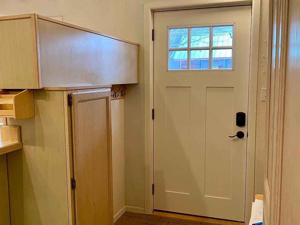 Entry with garage access to the right, from interior