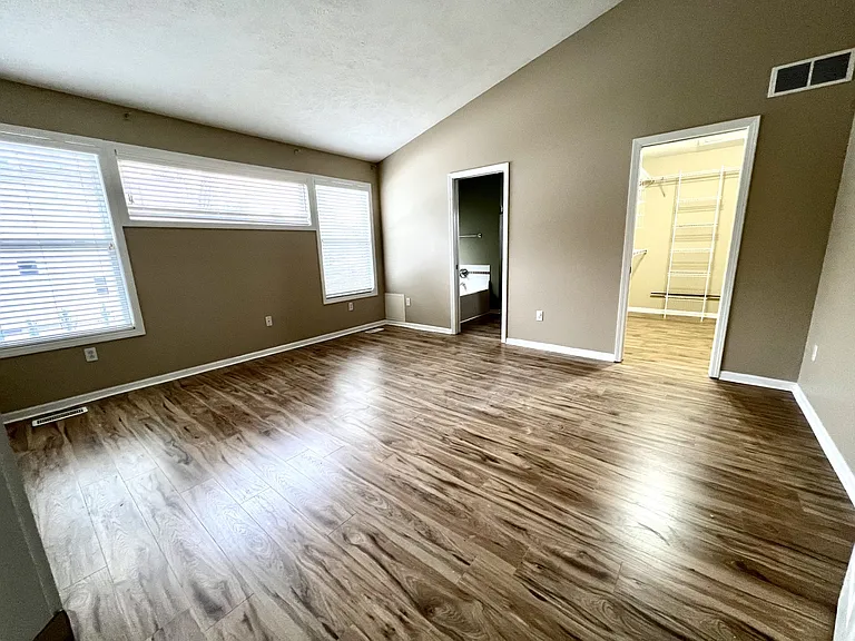 Primary bedroom suit with new laminate floor