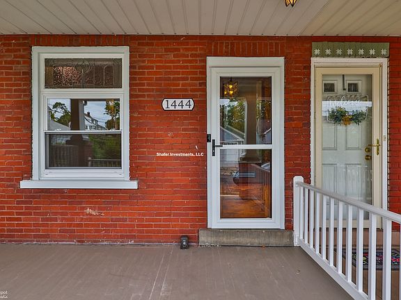 View of the front porch and the stained glass window