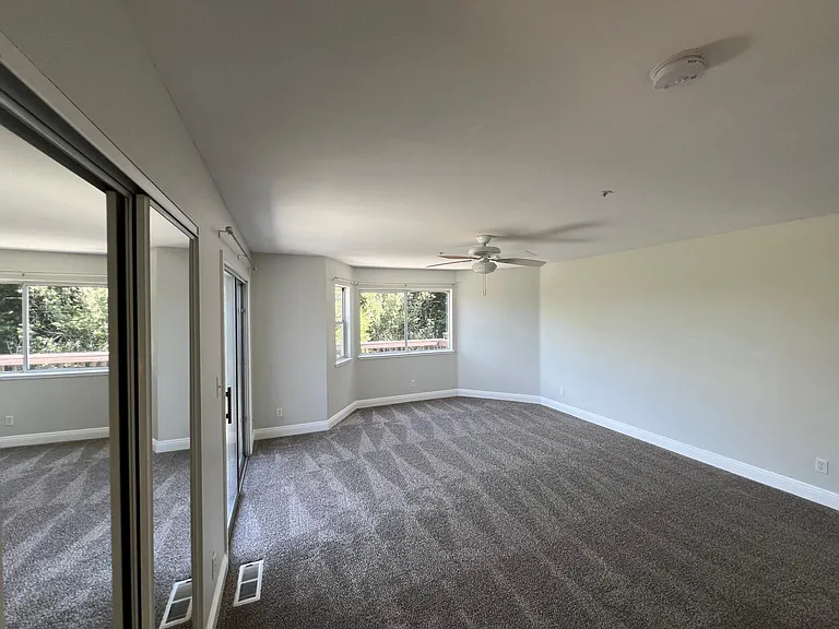 Expansive master bedroom with double closet, en suite, and balcony