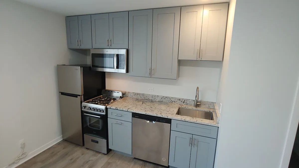 Building Photo - 5366 S Laramie Ave #204