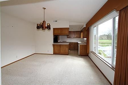 This spacious dining room is the perfect space between the living room and the kitchen and large eno