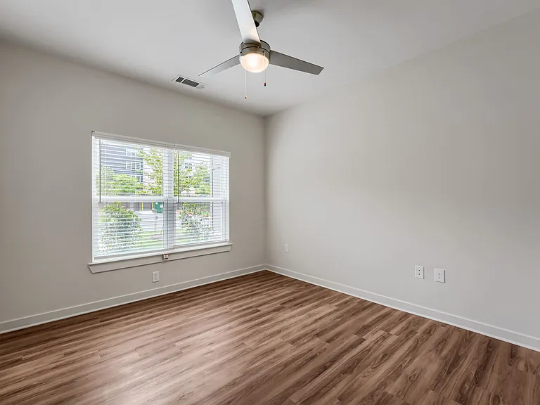 Bedroom with window and ceiling fan