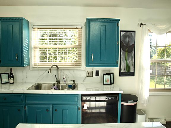 Kitchen overlooks backyard
