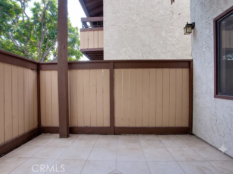 Private patio off living room. Picture from previous listing