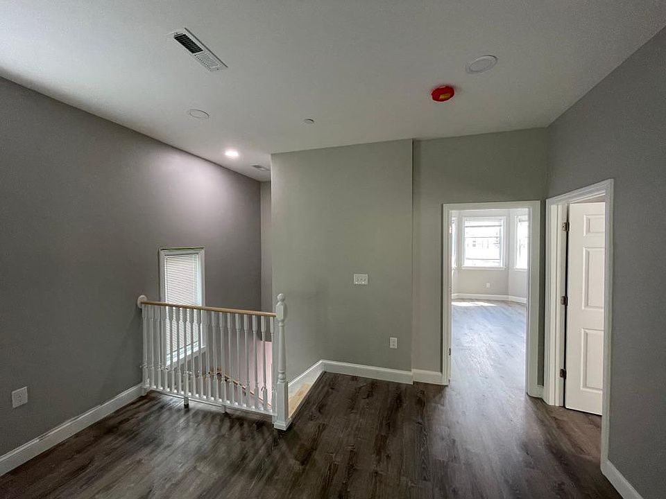 Unit two: (left to right) view of staircase/entry, master bedroom, bedroom one.