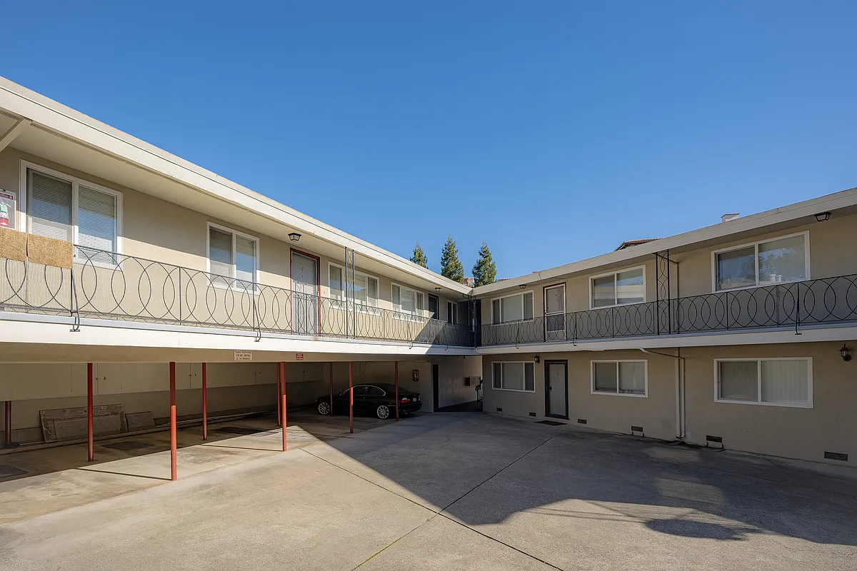 Experience the serenity of sunlit courtyard living in these delightful two-story apartments. - 15 S Broadway