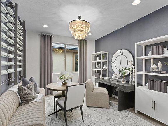 Quiet den at the front of the house makes a great home office.