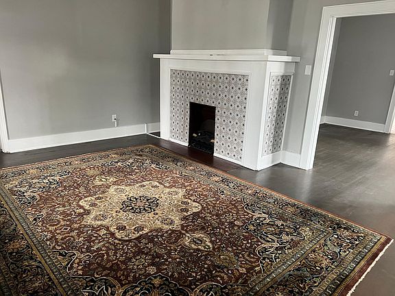 Family Room with view to fireplace and dining room on right.