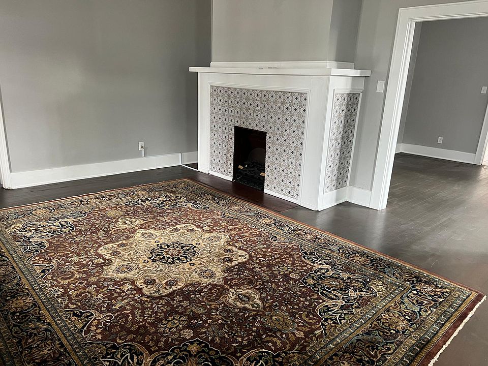 Family Room with view to fireplace and dining room on right.