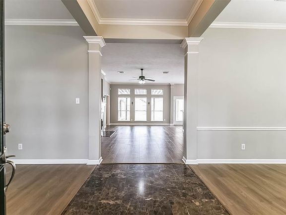 Open the door to your new home! Gorgeous flooring creates a subtle entry flanked by a formal living and dining room!