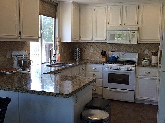 Kitchen features granite counter tops,