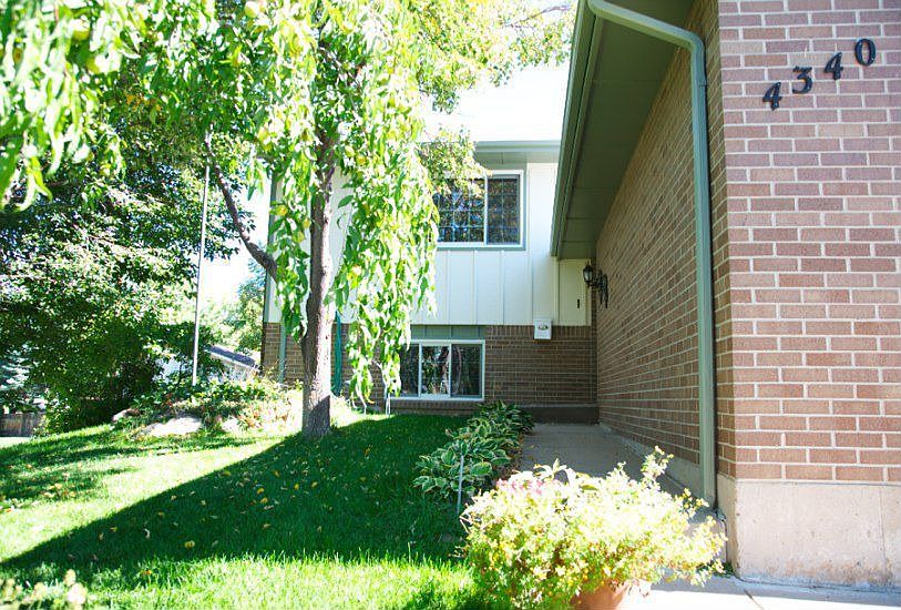 Welcoming front yard faces West
