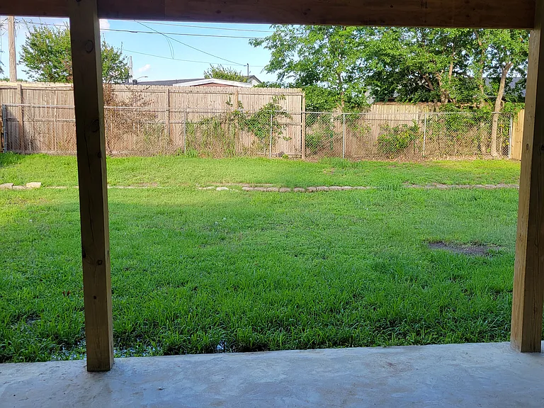 backyard with covered patio.