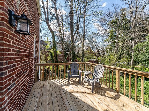 Spacious deck overlooking trees!