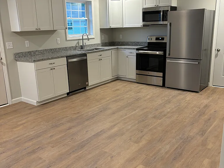 kitchen with granite counters, full size appliances
