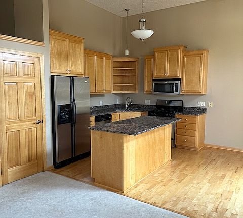 Gourmet cooks kitchen with stainless steel appliances and granite countertops.