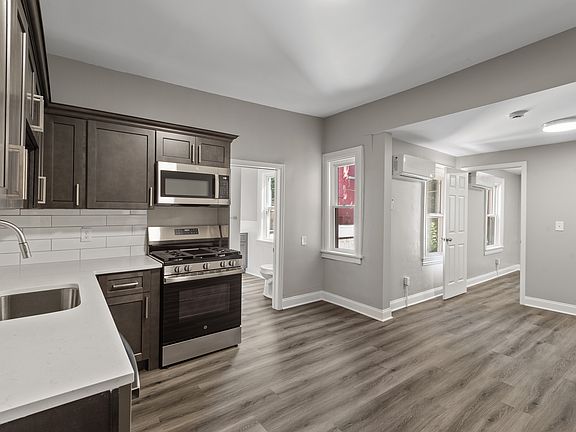 Kitchen with gas stove and dishwasher. All new appliances, quartz counters and new cabinets.