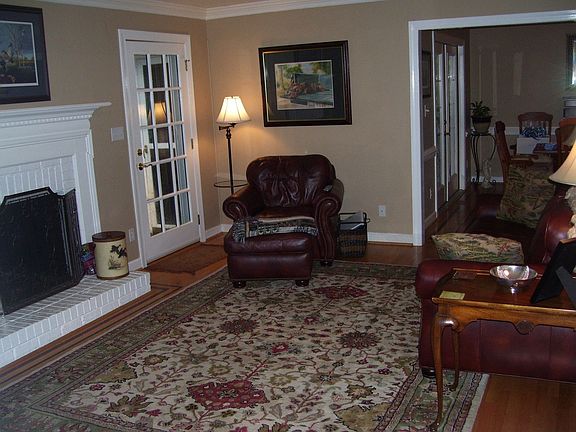 Another view of living room with fireplace