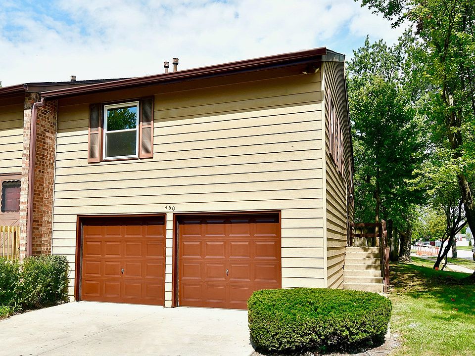Exterior front with private driveway and attached 2 car garage
