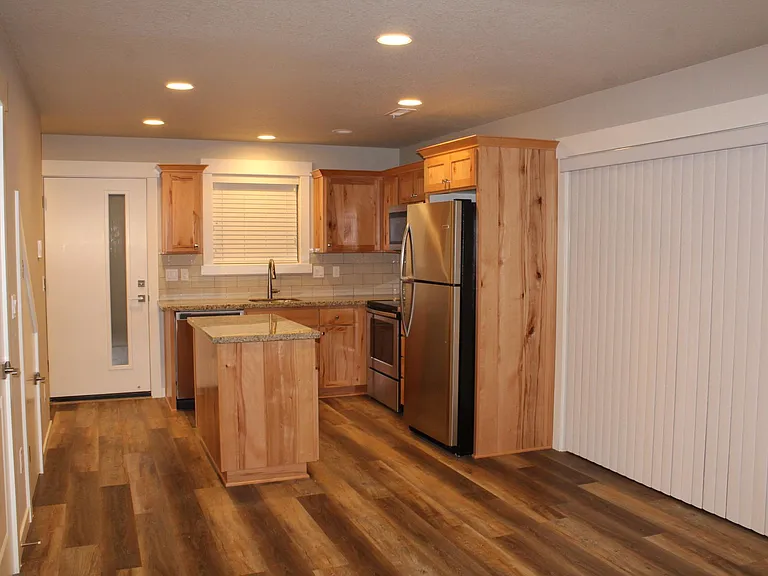 View from Great Room of Patio Door, Nook, Kitchen and Entryway