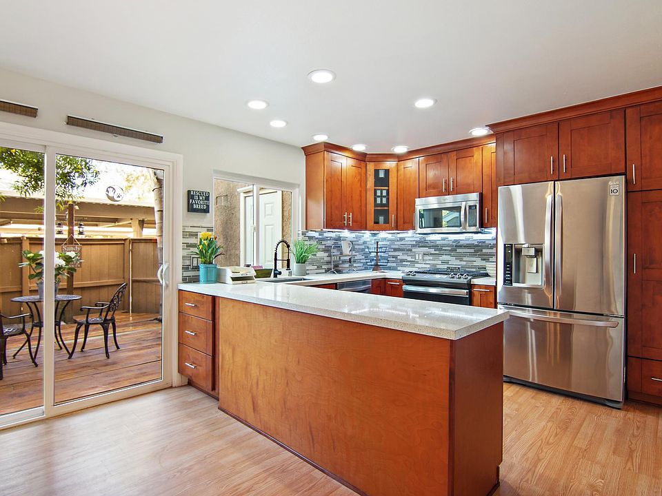 Updated Kitchen w/ Stainless steel appliances and under cabinet lighting.
