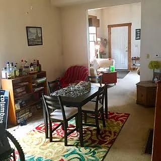 Dining room, view into living room and front door.