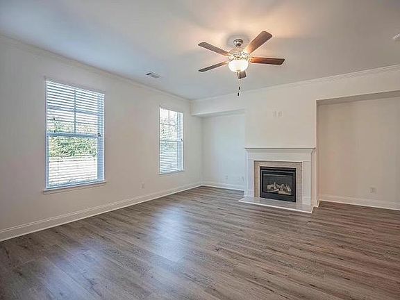 Large family room with SPC floor and gas log fireplace