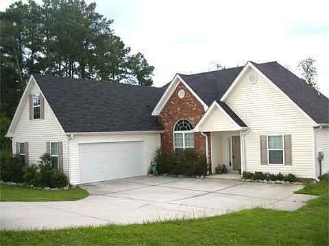 Adorable home with desired side-entry garage and maintenance-free vinyl siding