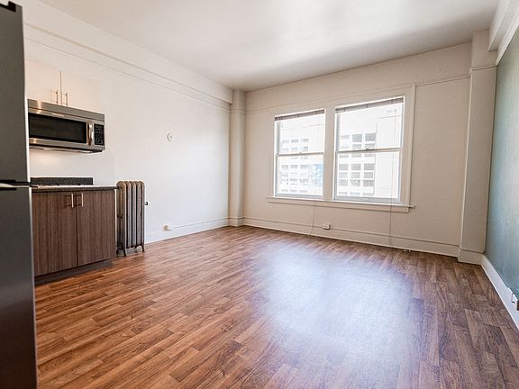 Seattle Apartments - Addison on Fourth Apartments - Living Room and Kitchen