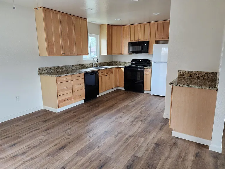 Kitchen - new flooring, all appliances included, large pantry.