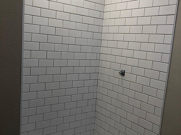 Master bath - brand new. 48" shower with new classic white subway tiles. Not pictured are new vanity, toilet etc.