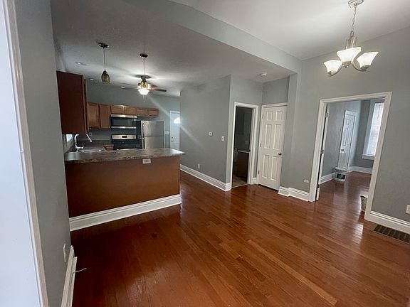 Living Room/Kitchen w/view of Bathroom & Front Bedroom